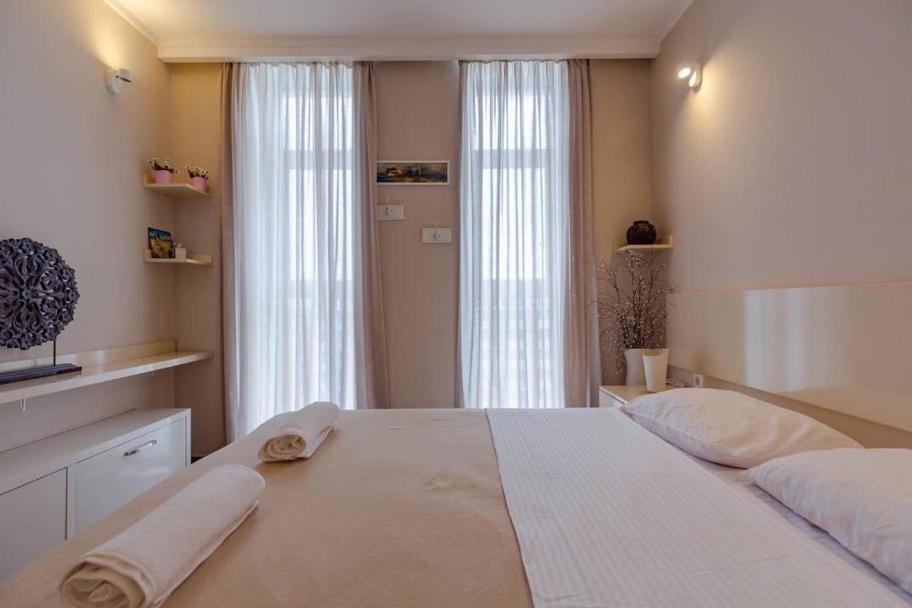 Ένα ή περισσότερα κρεβάτια σε δωμάτιο στο Wehost Apartment in Orbi tower