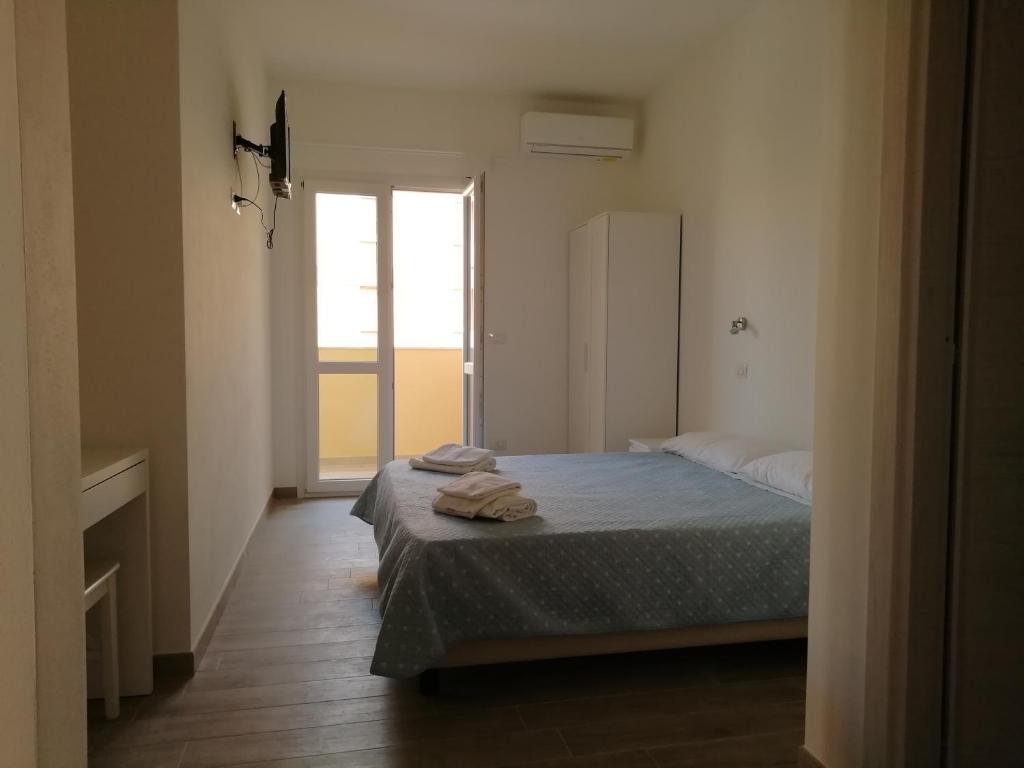 Posteľ alebo postele v izbe v ubytovaní DOMO ALGHERO CENTRO