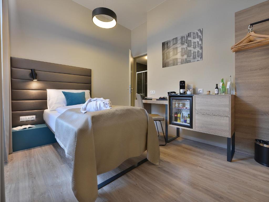 Postel nebo postele na pokoji v ubytování EA Hotel New Town