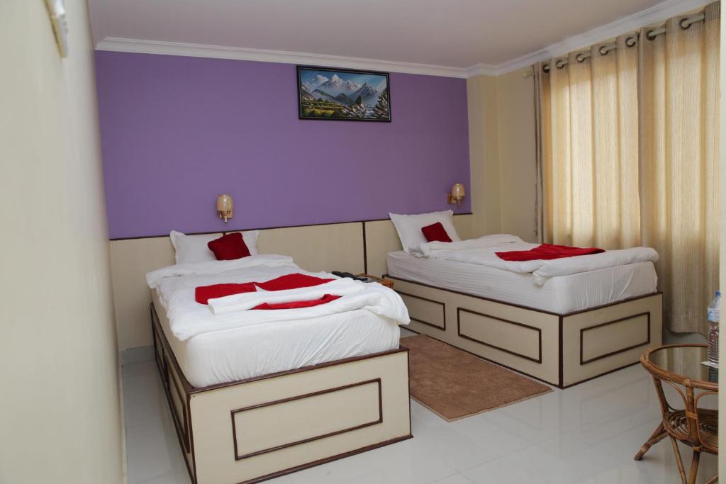 Postel nebo postele na pokoji v ubytování Hotel Tranquil