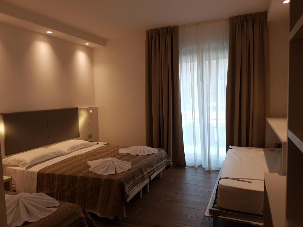 Postel nebo postele na pokoji v ubytování Hotel Aldebaran