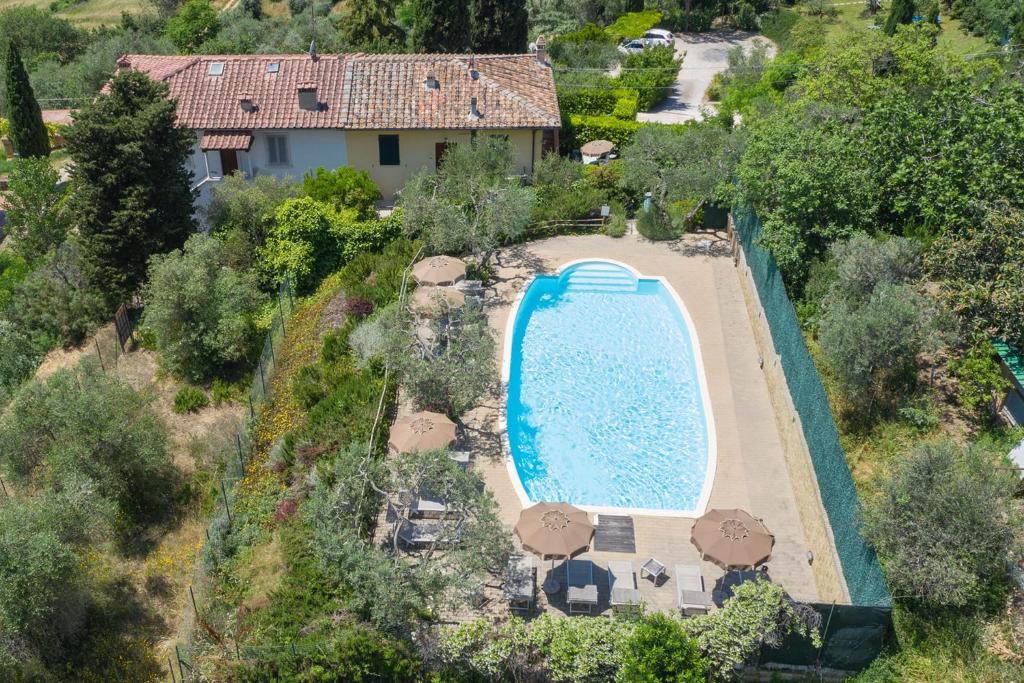 an aerial view of a house with a swimming pool at Podere Oliveta in Poggibonsi