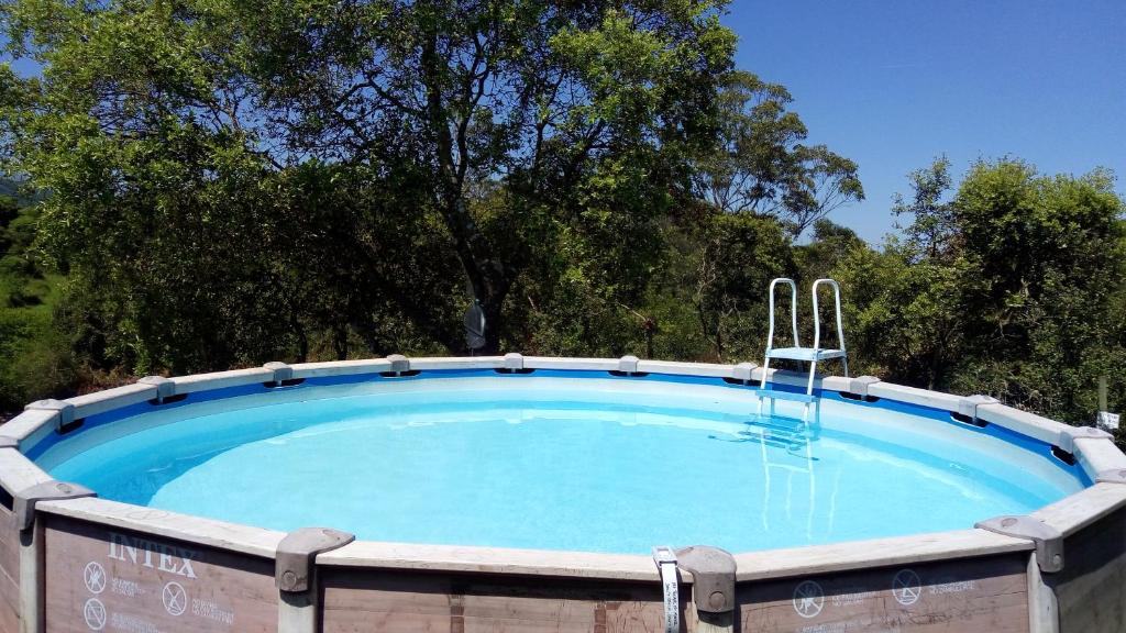 a large swimming pool in a yard at Playa La Franca apartamentos in La Franca