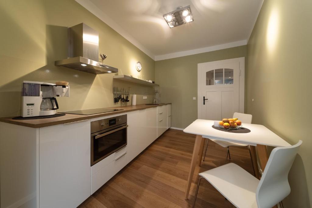 Kuchyň nebo kuchyňský kout v ubytování Carl.22 City Appartements