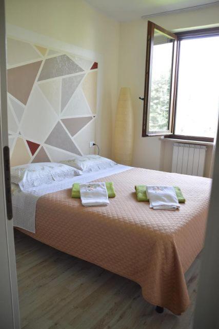Postel nebo postele na pokoji v ubytování Cinzia's Home