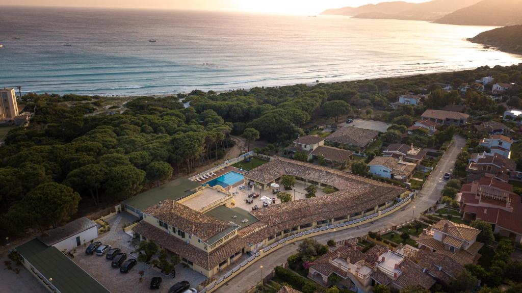 an aerial view of a resort next to the ocean at Hotel Fiore Di Maggio in Villasimius