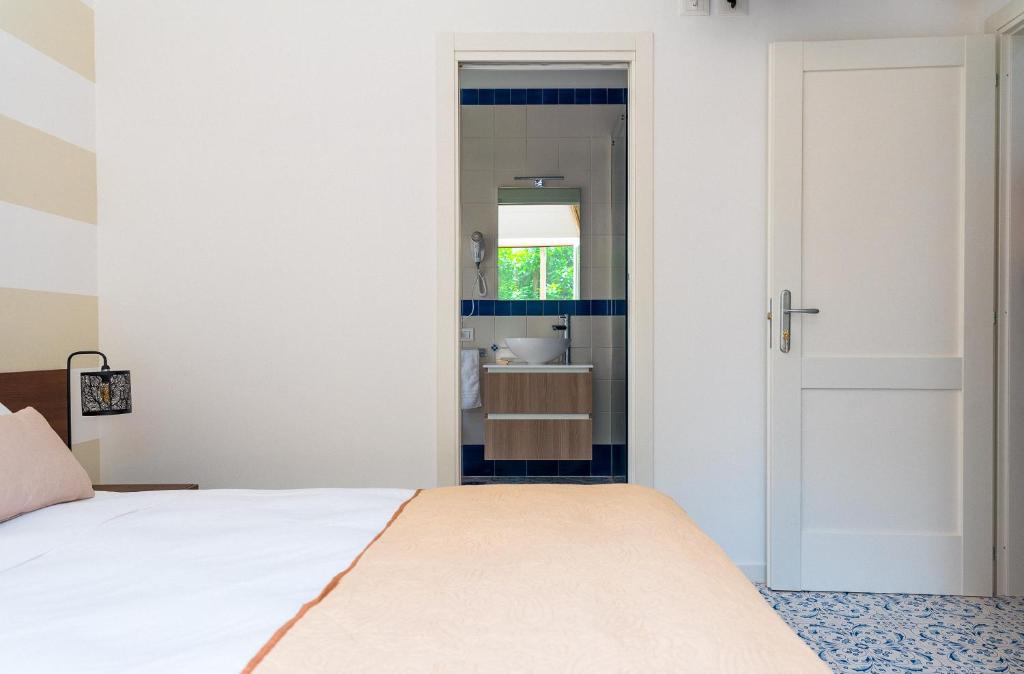 Postel nebo postele na pokoji v ubytování LUXURY NAPOLITANO