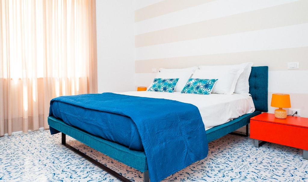 Postel nebo postele na pokoji v ubytování LUXURY NAPOLITANO