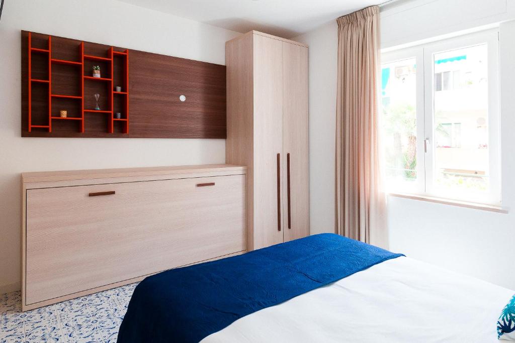 Postel nebo postele na pokoji v ubytování LUXURY NAPOLITANO