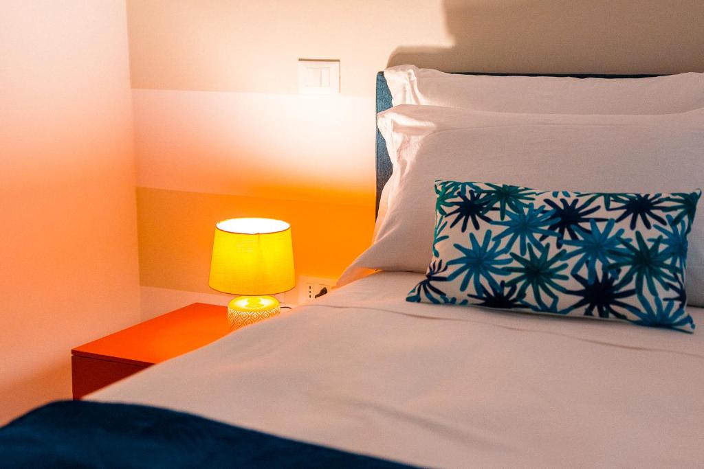 Postel nebo postele na pokoji v ubytování LUXURY NAPOLITANO