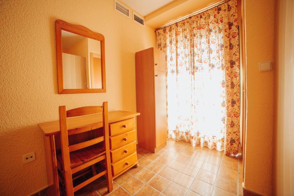 Postel nebo postele na pokoji v ubytování Apartamentos Palm Court