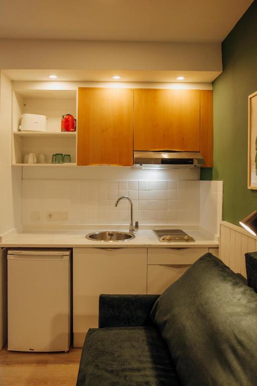Kuchyň nebo kuchyňský kout v ubytování Apartamentos Palm Court