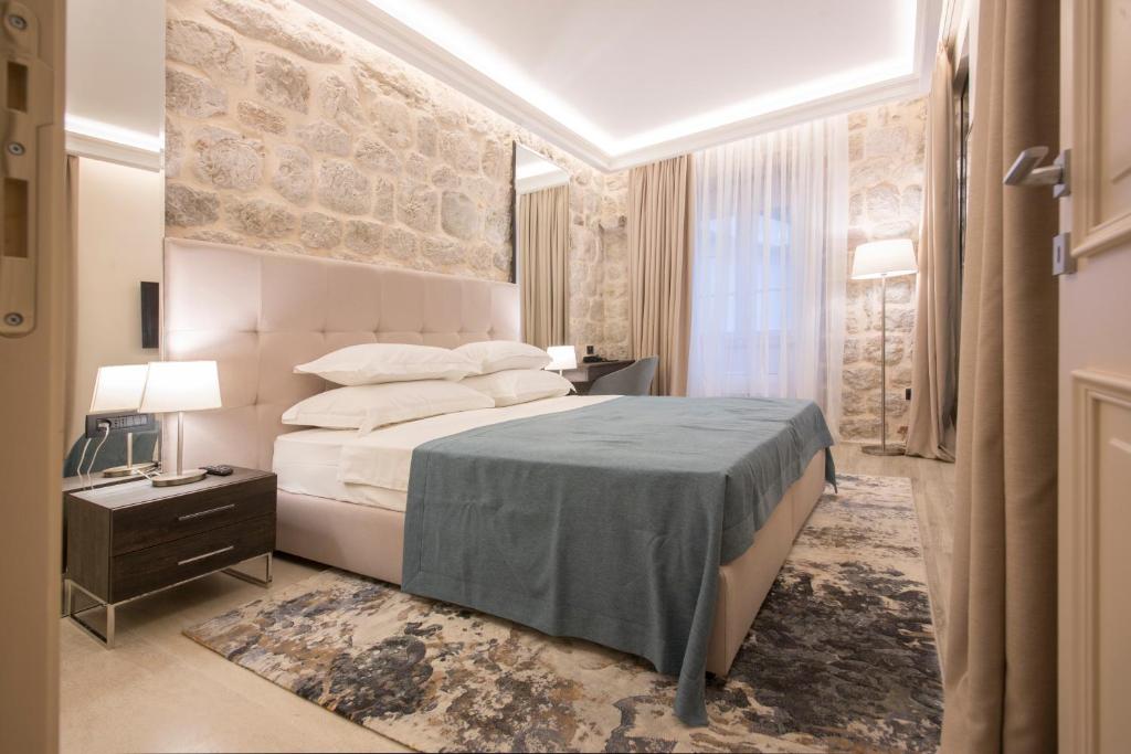 Postel nebo postele na pokoji v ubytování Heritage Hotel Leon Coronato