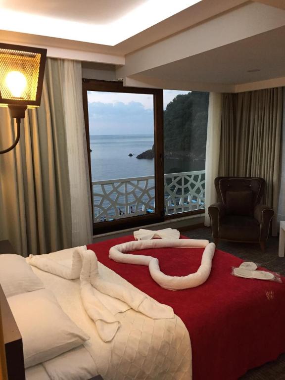 Postel nebo postele na pokoji v ubytování Yildiz Apart Hotel
