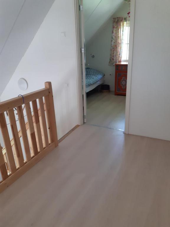 Postel nebo postele na pokoji v ubytování Zeeuws Huisje Colijnsplaat