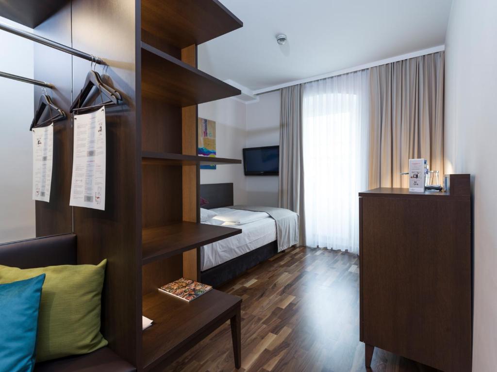 Krevet ili kreveti u jedinici u okviru objekta Hotel Sandwirth