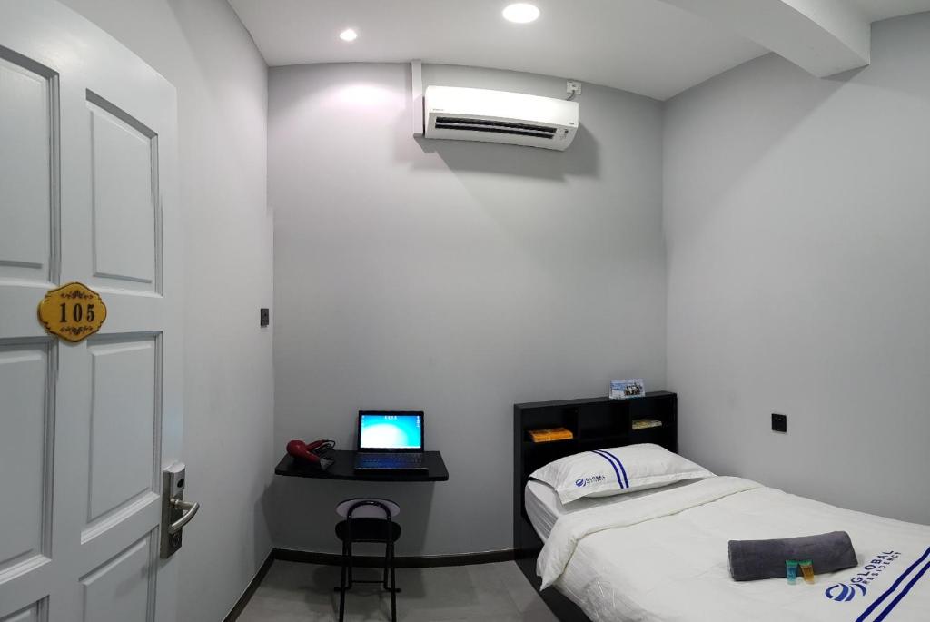 Postel nebo postele na pokoji v ubytování Global Residency