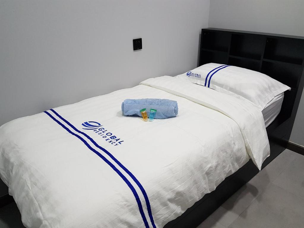 Postel nebo postele na pokoji v ubytování Global Residency