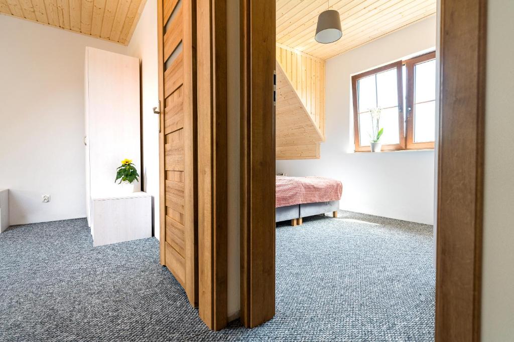 Postel nebo postele na pokoji v ubytování Osada Słowińska