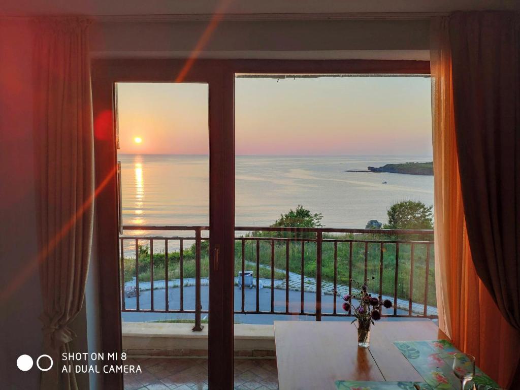 a room with a window with a view of the ocean at INESA in Tsarevo