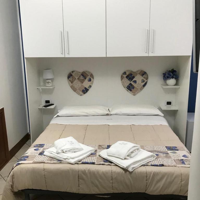 Łóżko lub łóżka w pokoju w obiekcie B&B Foria 210