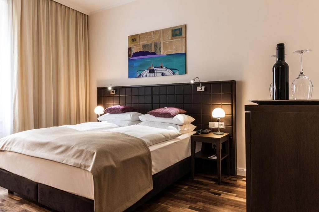 Krevet ili kreveti u jedinici u okviru objekta Hotel Sandwirth