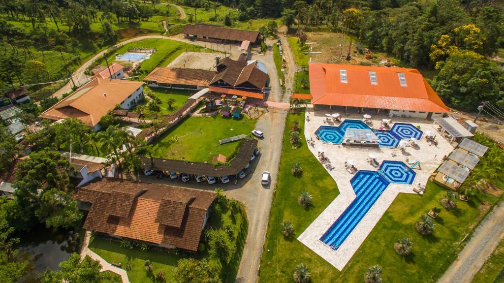 an overhead view of a house with a yard at Hotel Fazenda Dona Francisca in Joinville