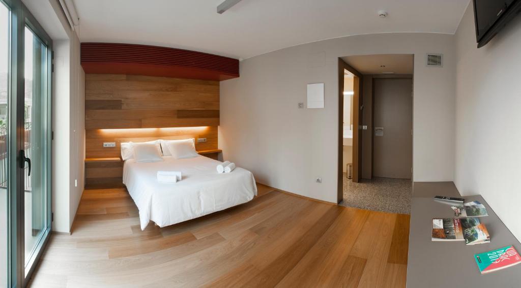 Postel nebo postele na pokoji v ubytování Hotel Estació