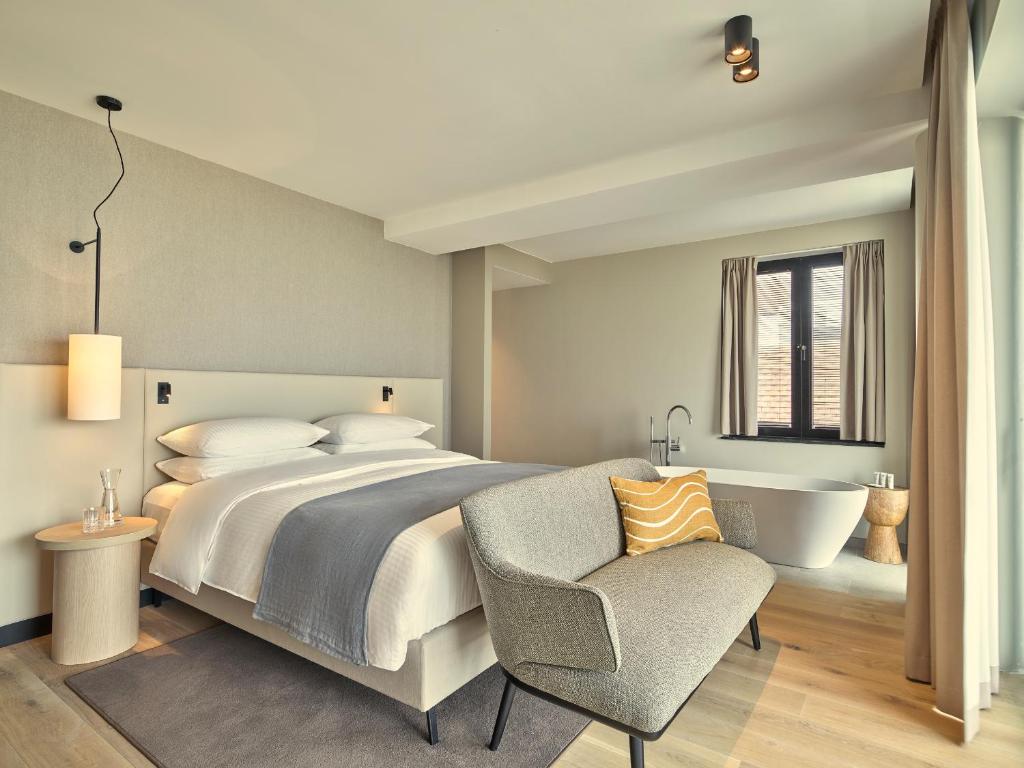 Un ou plusieurs lits dans un hébergement de l'établissement Hotel de Blanke Top