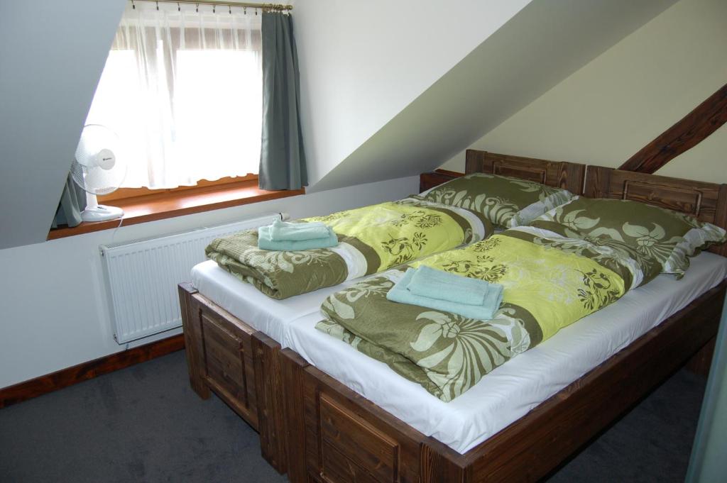 Postel nebo postele na pokoji v ubytování Hotel Pudlov