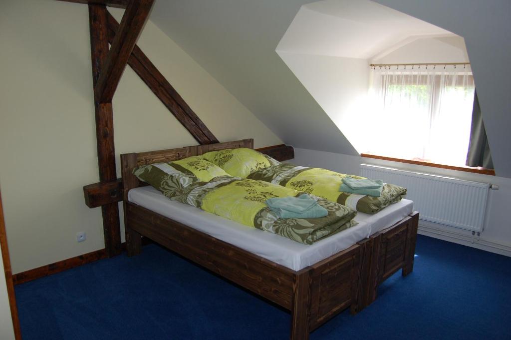Postel nebo postele na pokoji v ubytování Hotel Pudlov