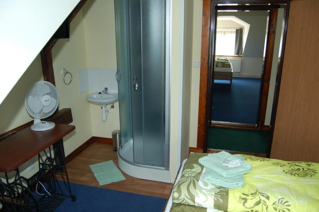 Postel nebo postele na pokoji v ubytování Hotel Pudlov