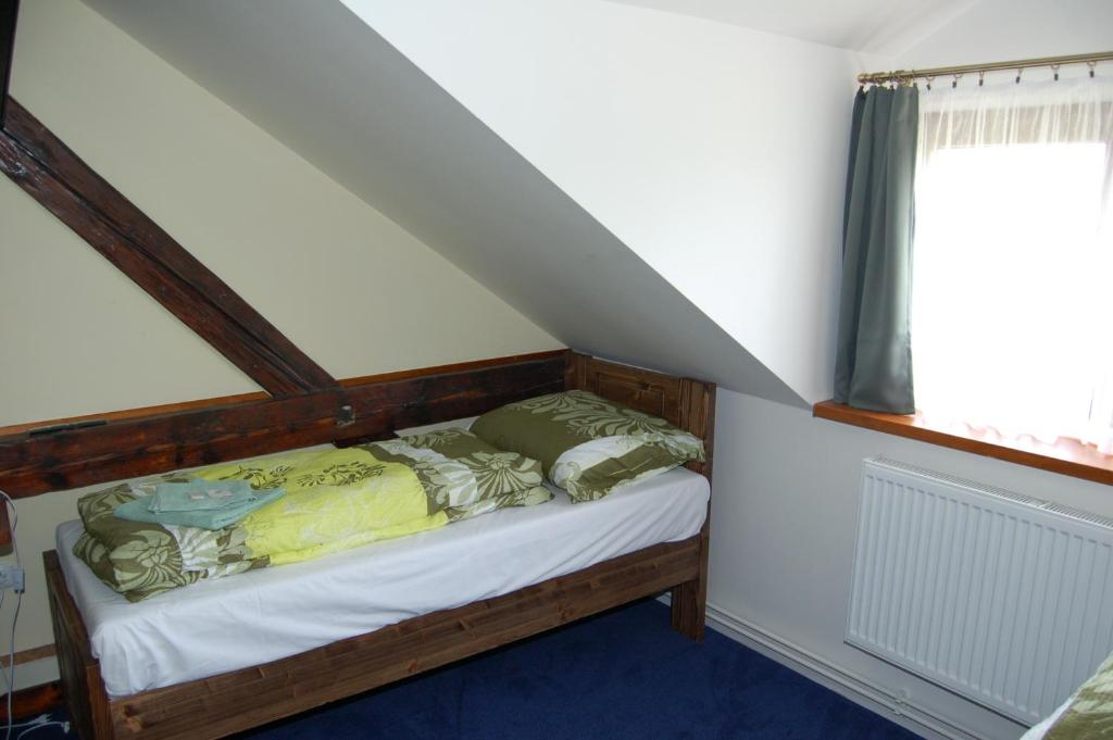 Postel nebo postele na pokoji v ubytování Hotel Pudlov