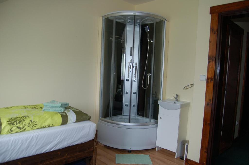 Postel nebo postele na pokoji v ubytování Hotel Pudlov