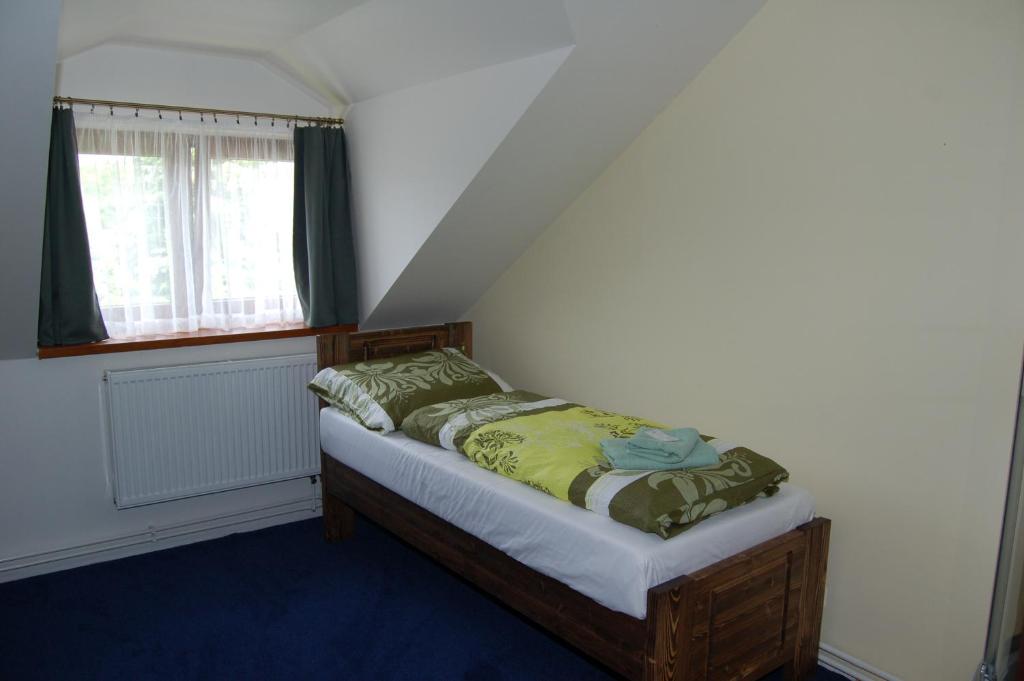 Postel nebo postele na pokoji v ubytování Hotel Pudlov