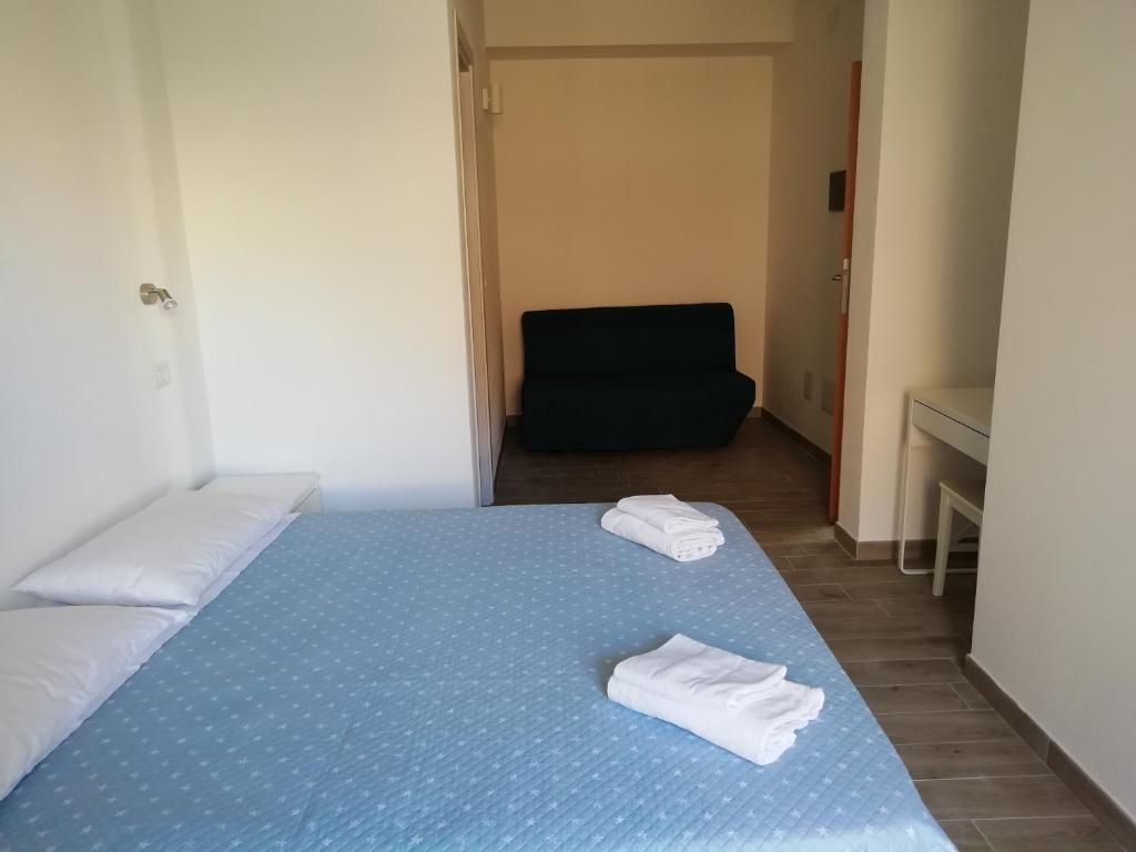 Posteľ alebo postele v izbe v ubytovaní DOMO ALGHERO CENTRO
