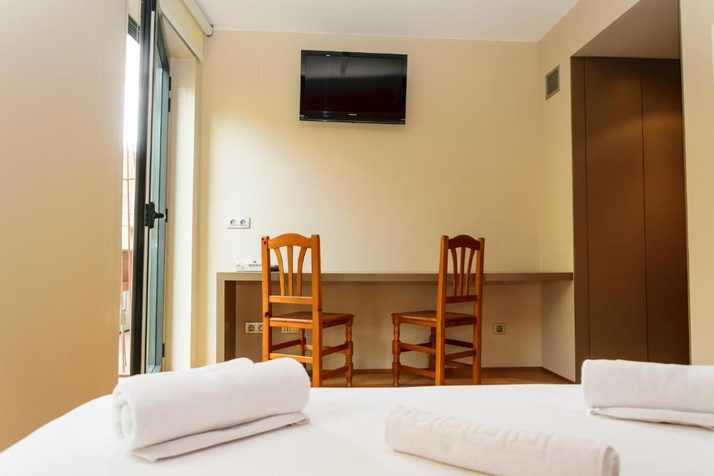 Postel nebo postele na pokoji v ubytování Hotel Estació