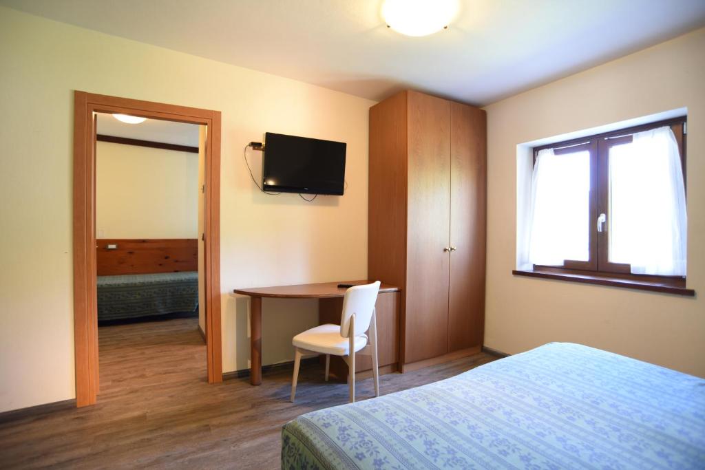 Posteľ alebo postele v izbe v ubytovaní Albergo Bucaneve