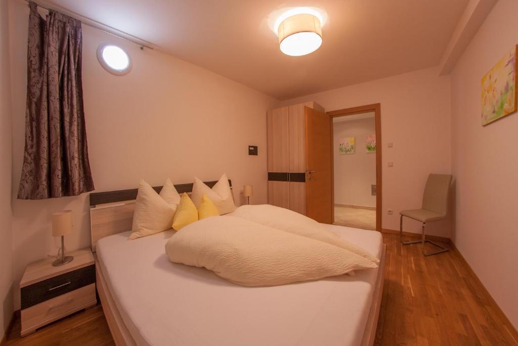 Posteľ alebo postele v izbe v ubytovaní Appartements Verdinserhöhe