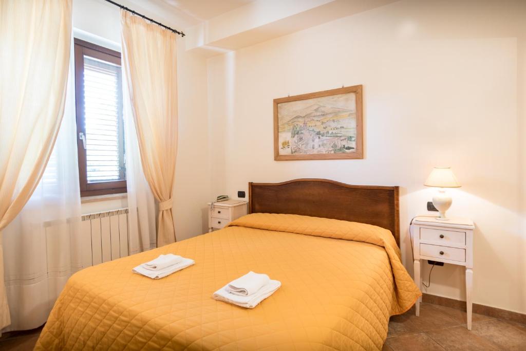 Letto o letti in una camera di Bed & Breakfast Al Pian d'Assisi