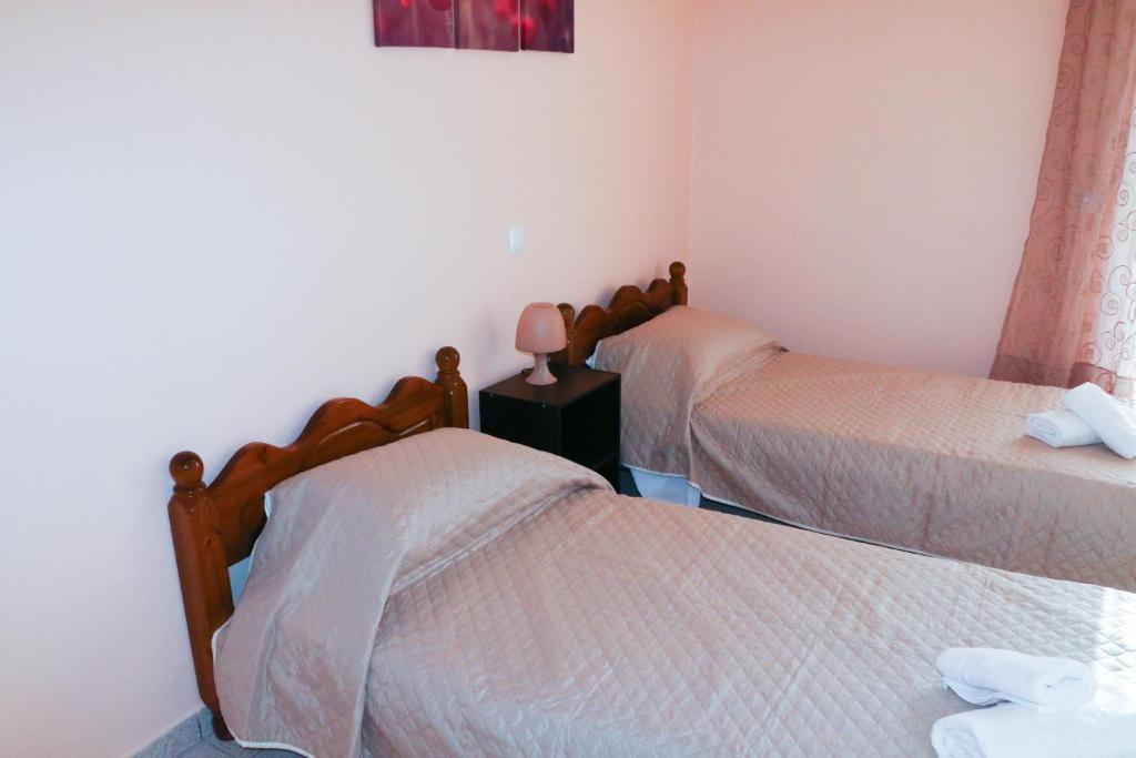 A bed or beds in a room at Nikolas view house