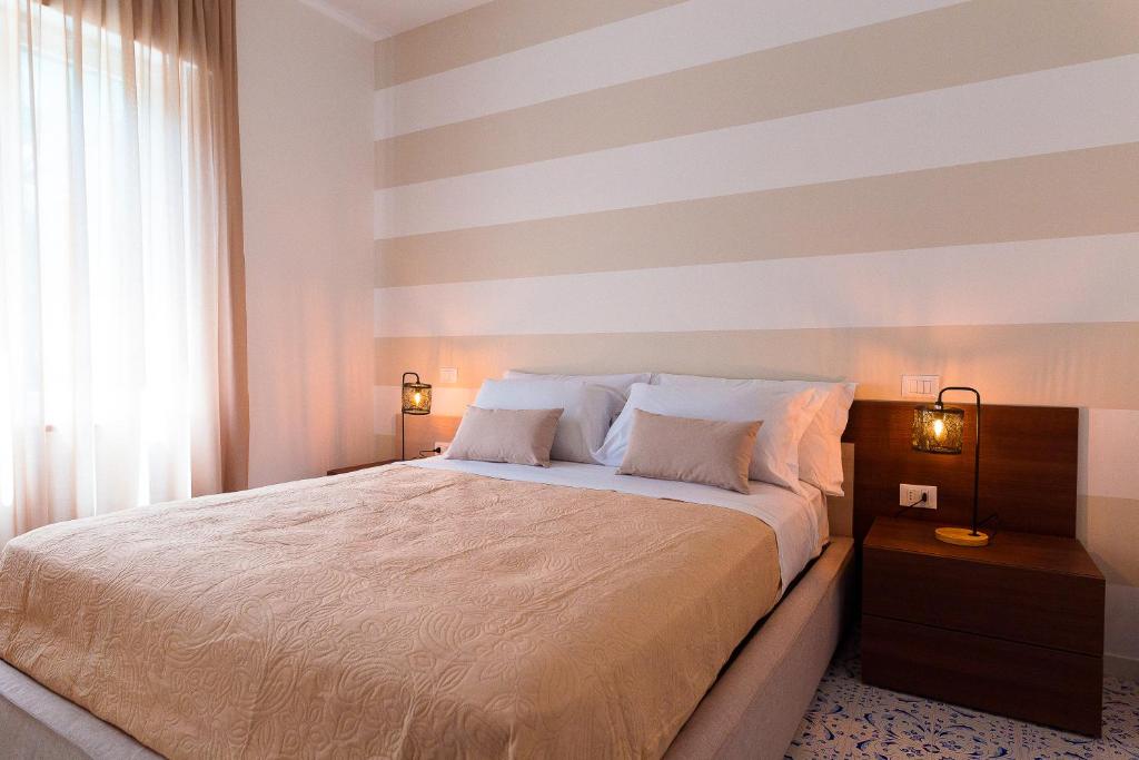 Postel nebo postele na pokoji v ubytování LUXURY NAPOLITANO