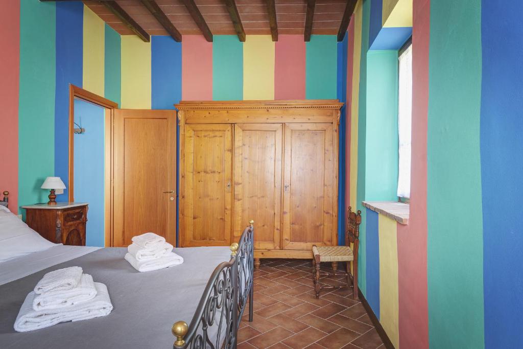 Postel nebo postele na pokoji v ubytování Palazzo Gatteschi