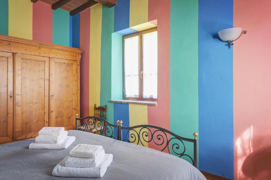 Postel nebo postele na pokoji v ubytování Palazzo Gatteschi