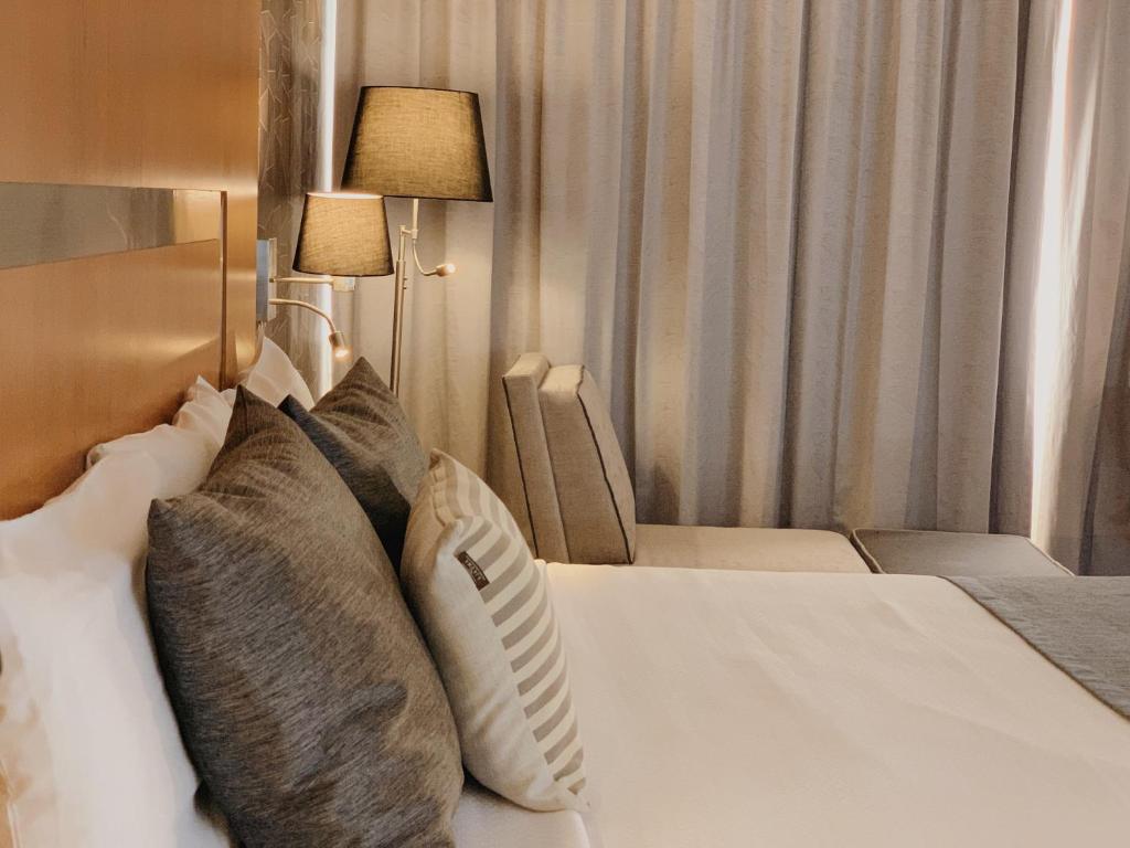 Postel nebo postele na pokoji v ubytování Hotel Mercury Inn