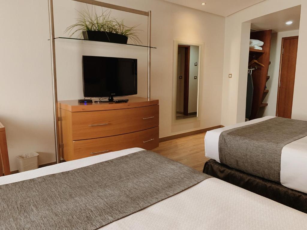 Postel nebo postele na pokoji v ubytování Hotel Mercury Inn