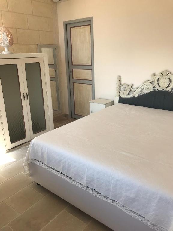 Łóżko lub łóżka w pokoju w obiekcie Relais Grottone
