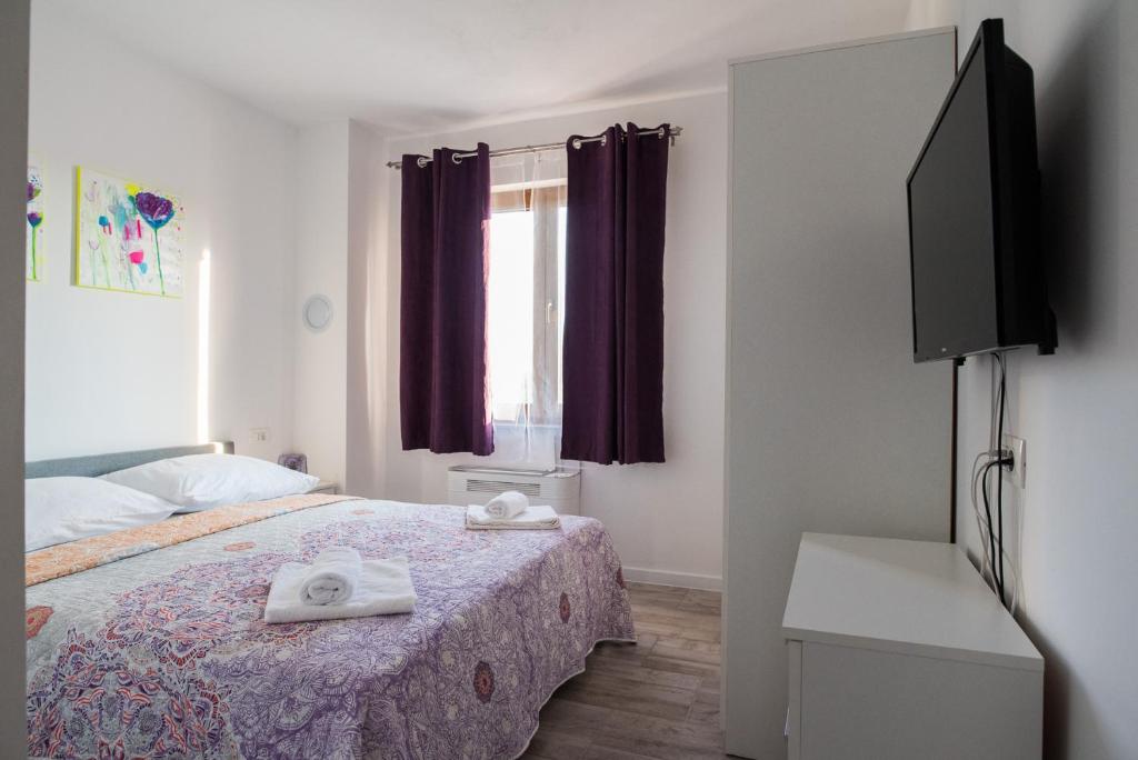 Postel nebo postele na pokoji v ubytování Apartments MARIO