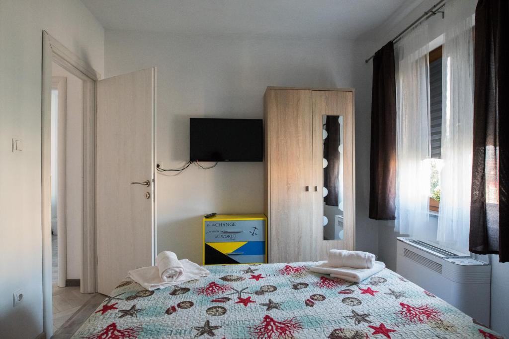 Postel nebo postele na pokoji v ubytování Apartments MARIO
