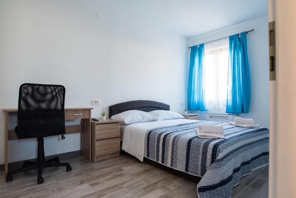 Postel nebo postele na pokoji v ubytování Apartments MARIO